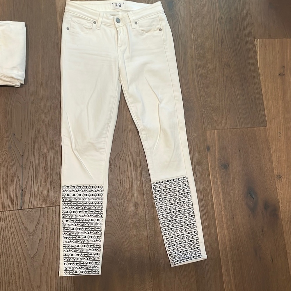 Paige vertigo ankle jeans with navy blue embroidered pattern on bottom